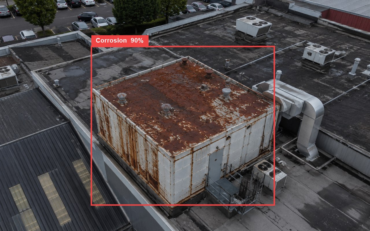 Real AI defect detection: corrosion flagged on a commercial rooftop with a bounding box